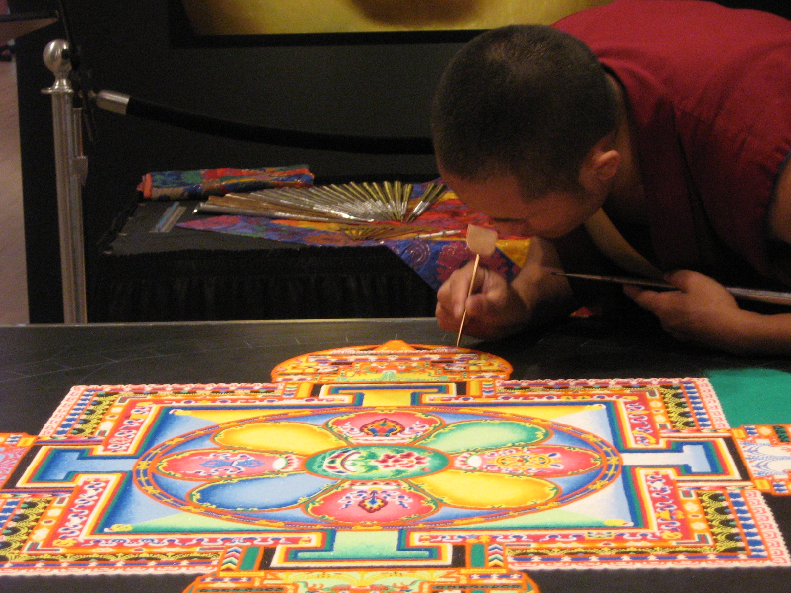 Monk working on mandala