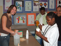 Undergraduate s-l student and school 19 student help parent with slime at Parent Night