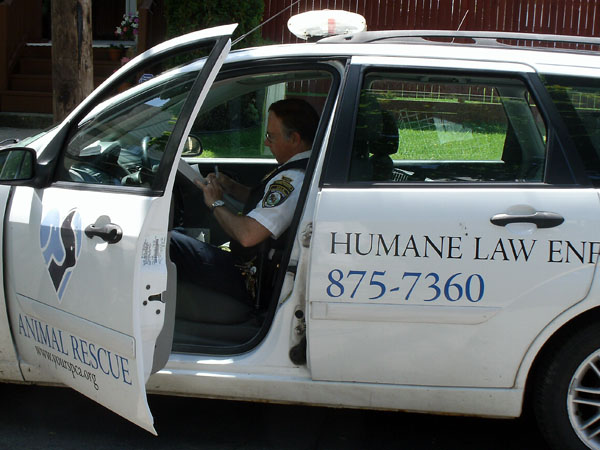 Officer Armatys from Erie County SPCA filling out report on dog abuse, May 2012. Photo by author.