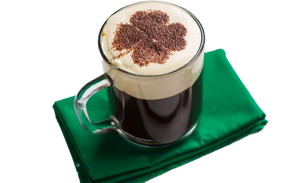 Cup of coffee with a shamrock on top.