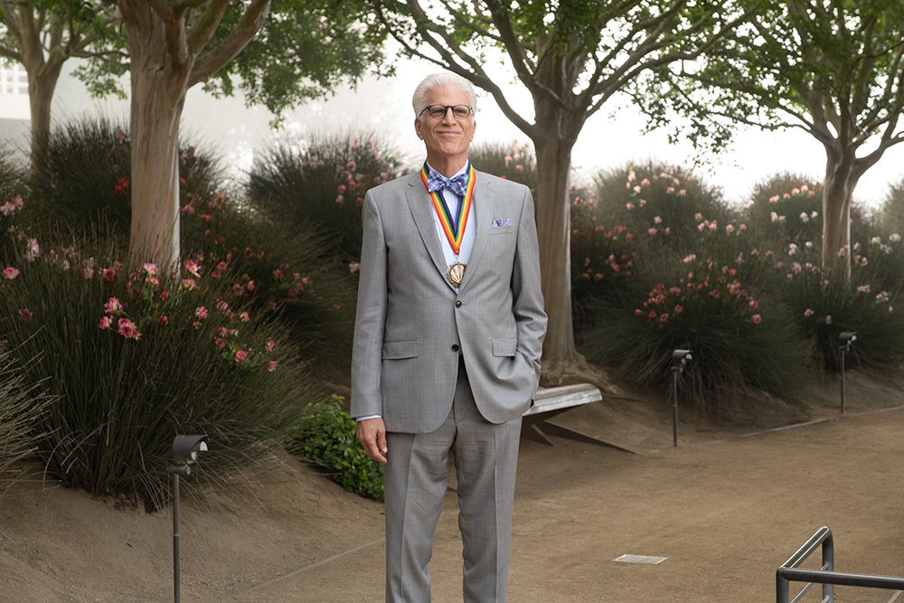 Man proudly wearing a medal.