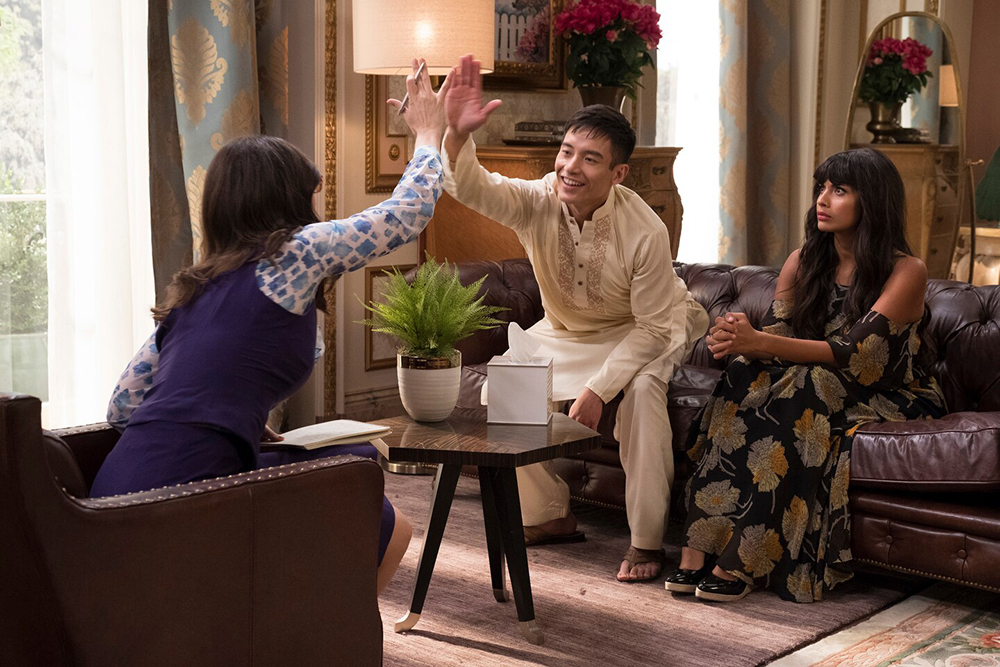 Two people give each other a high five.