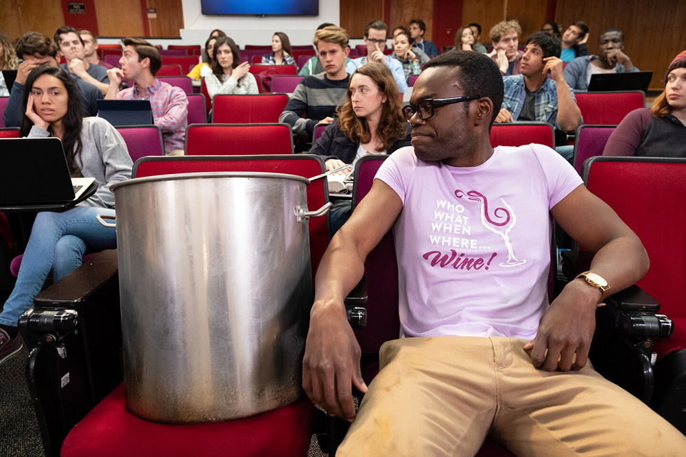 Professor sitting in lecture hall with a pot of chili.
