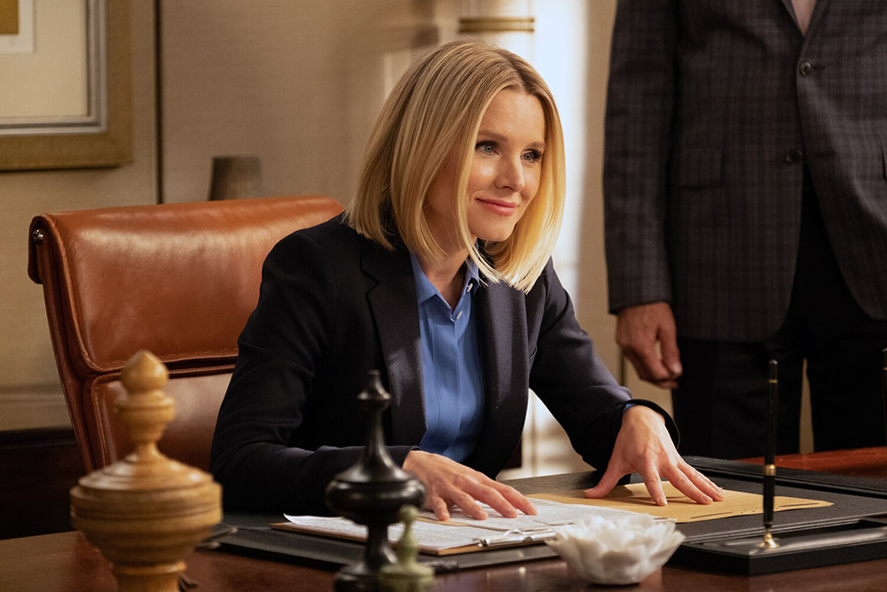 A leader sits at her desk.