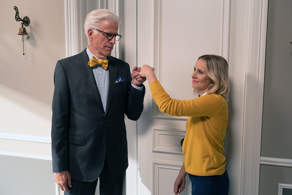 Two people fist bump.