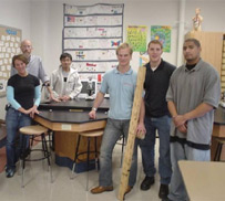 Figure 1. Teacher Heather Maciejewski of School 19 in renovated laboratory with physics/ engineering student team